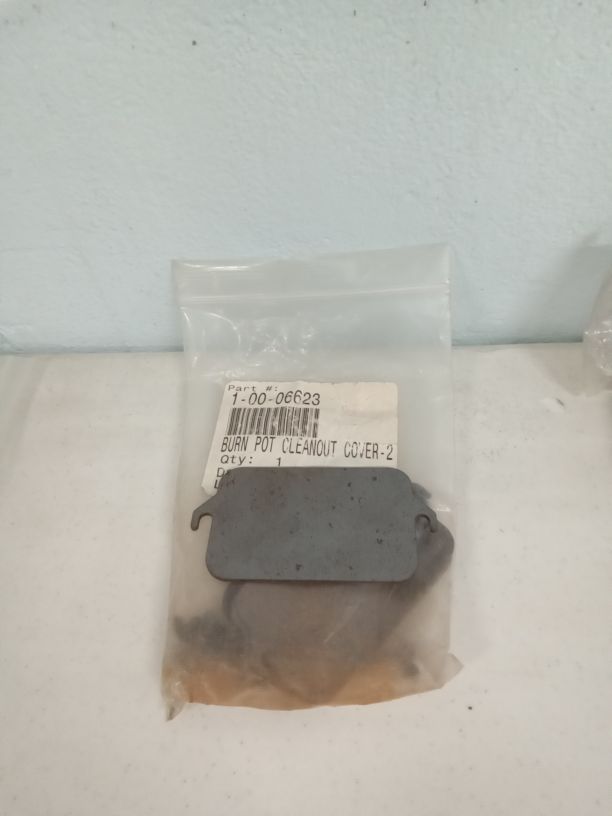 Burn pot clean out plate with screws